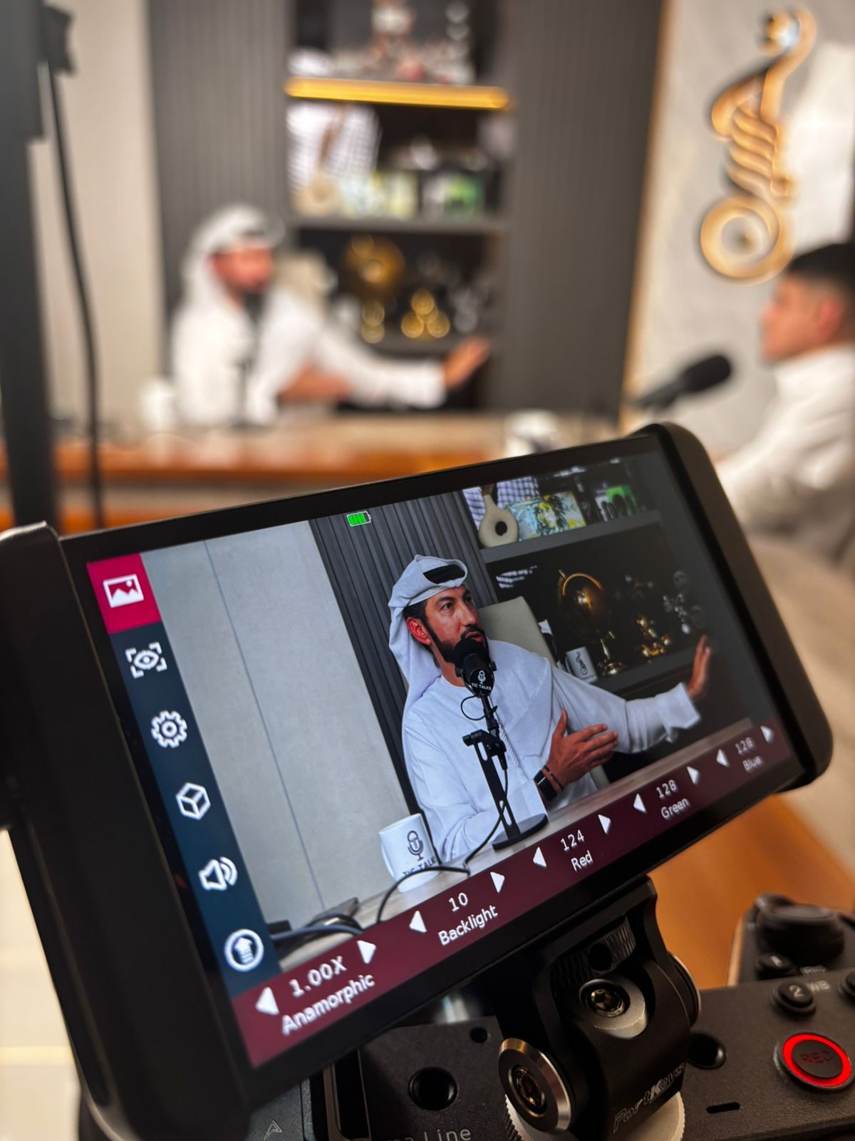 Podcast production viewed through a professional camera monitor